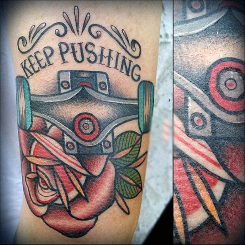 Old school style colored skating dedicated tattoo on arm with lettering and flower