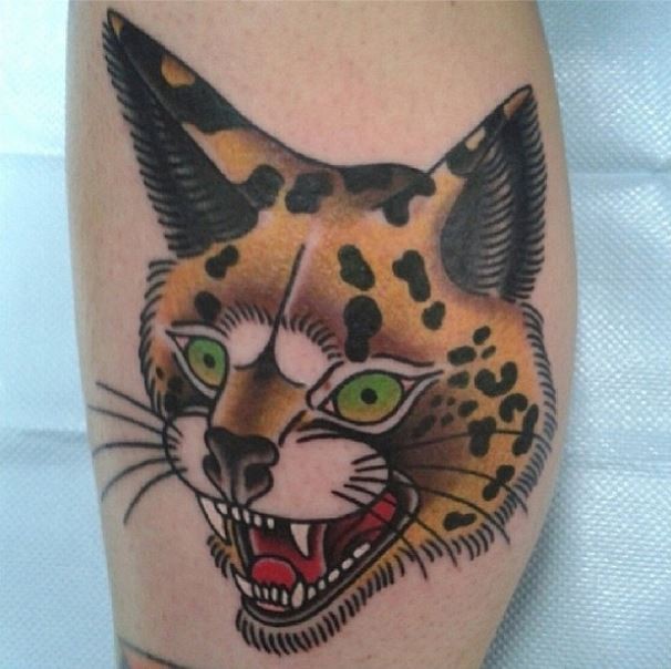 Old school style colored small tattoo of caracal head