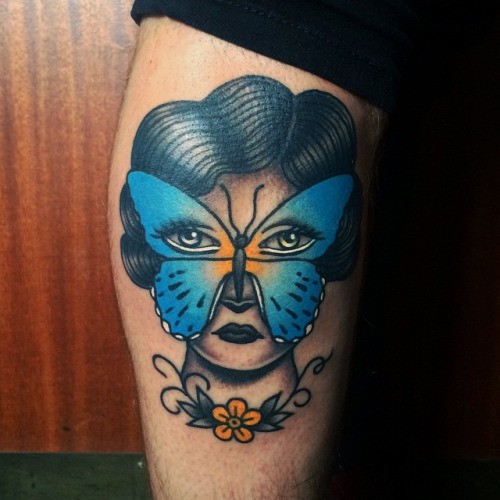Old school style colored tattoo of woman with butterfly mask