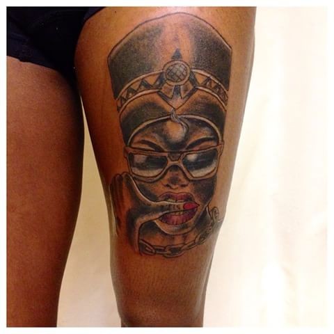 Old school style colored thigh tattoo of Egypt woman with sunglasses