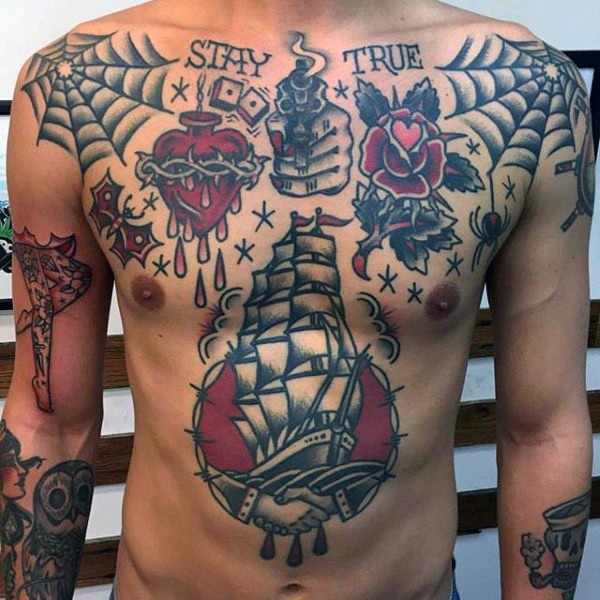 Old school style colored whole chest tattoo of various pictures and lettering