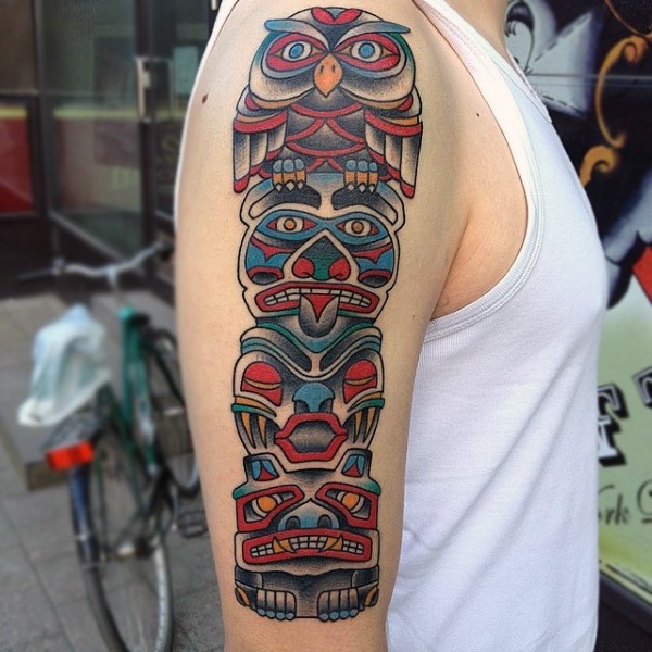 Old school style colorful tribal Gods statue shoulder length tattoo