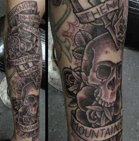 Old school style designed black and white skull with lettering and old key tattoo on leg