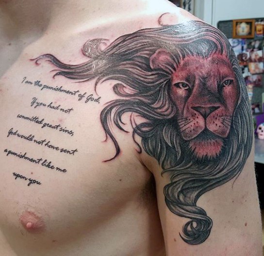 Old school style illustrative style lion head tattoo on shoulder with lettering