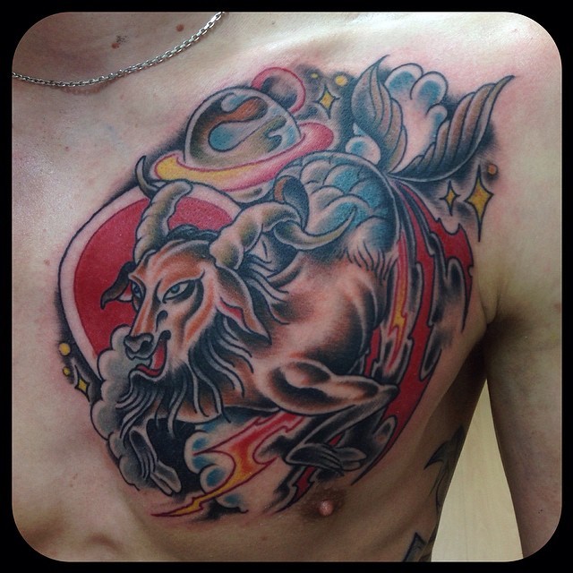 Old school style multicolored chest tattoo of Capricorn with lightning and stars