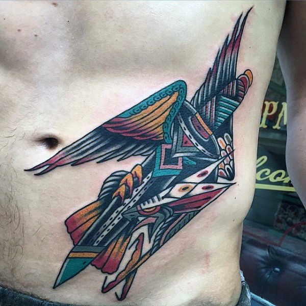 Old school style multicolored eagle with sword tattoo on waist