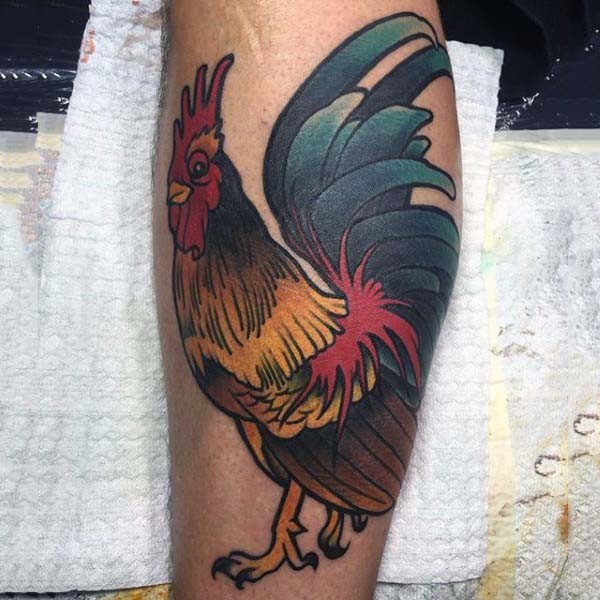 Old school style painted and colored big cock tattoo on leg