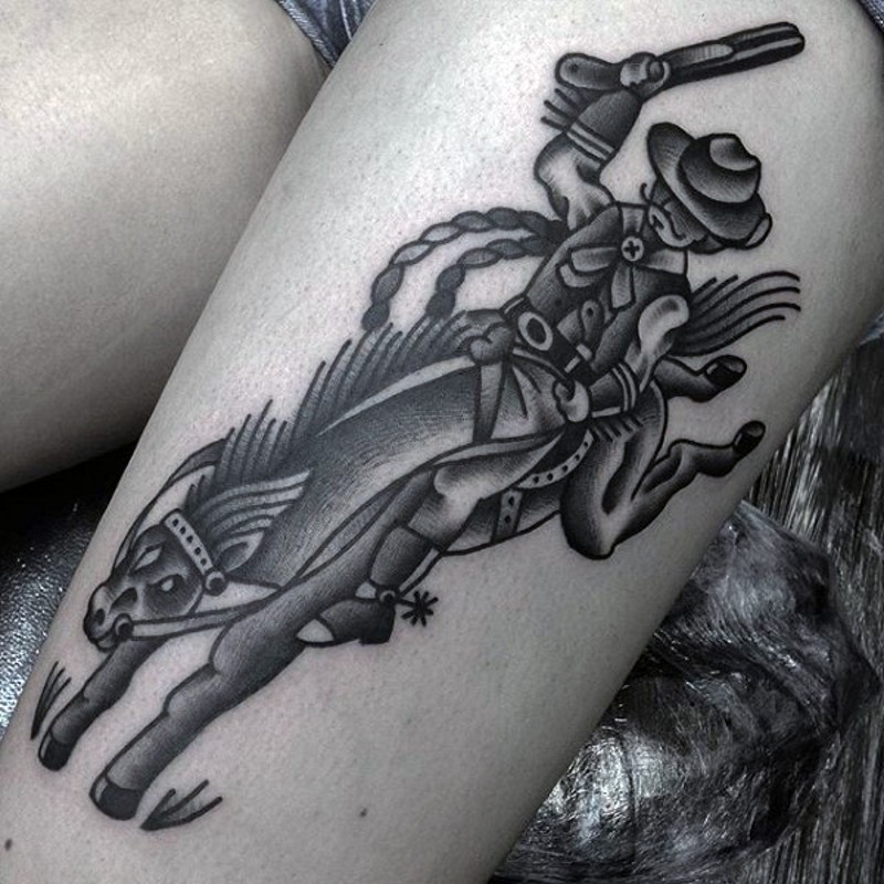Old school style painted black and white cowboy tattoo on thigh