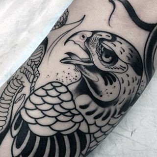 Old school style painted black and white eagle tattoo on arm