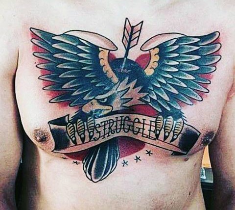 Old school style painted multicolored eagle with arrow ad lettering tattoo on chest