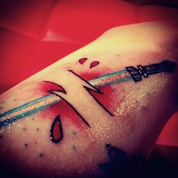 Old school style under skin like blue colored lightsaber tattoo on arm