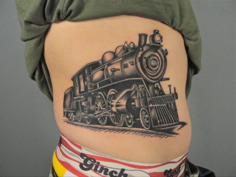 Old school type black ink side tattoo of running train