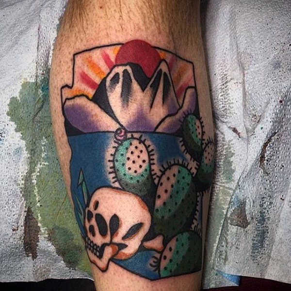 Old shool style colored leg tattoo of cactus with mountains