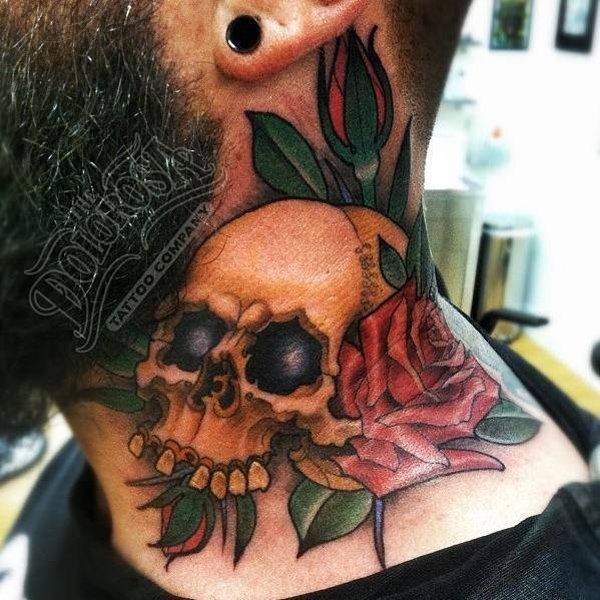 Old style colored skull tattoo on neck combined with red rose flower