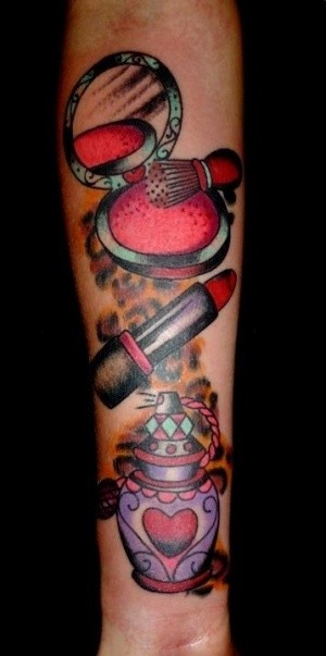 Old style colored various cosmetics tattoo on arm