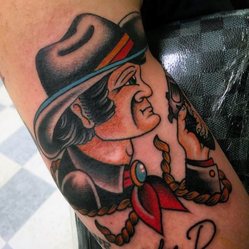 Old style colored western cowboy tattoo on arm