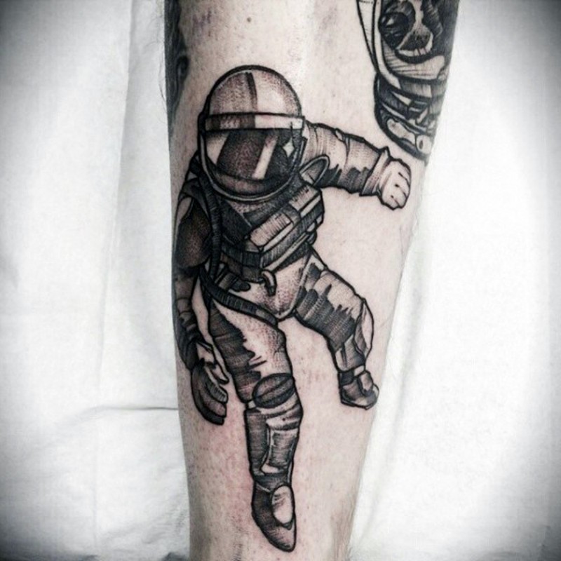 Old style designed black ink astronaut tattoo on arm