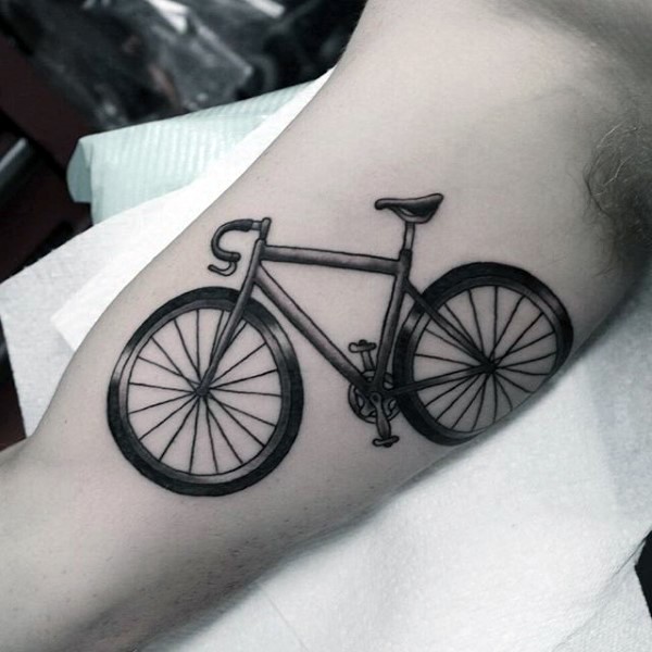 Old style detailed cycle tattoo on biceps