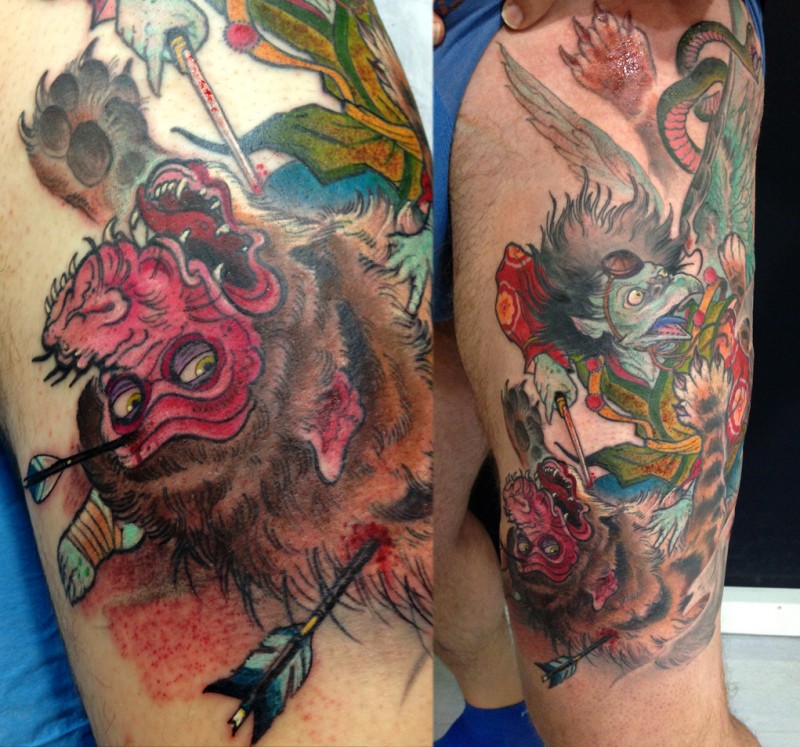 Old style painted colored thigh tattoo of fantasy animals fight