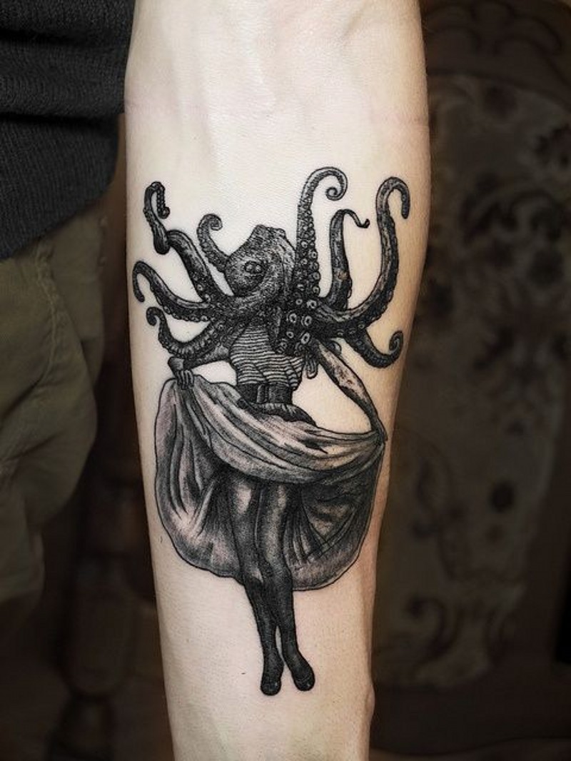 Old style pin up girl with octopus on head arm tattoo