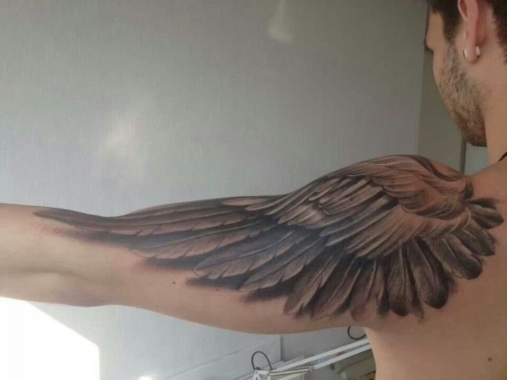 One black wing tattoo on half sleeve