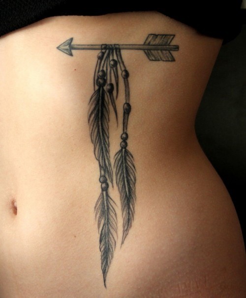 One indian arrow tattoo with feathers and beads