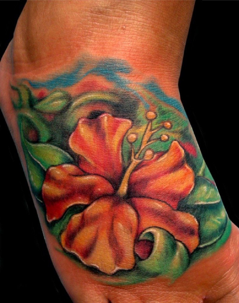 Orange hibiscus flower tattoo on foot