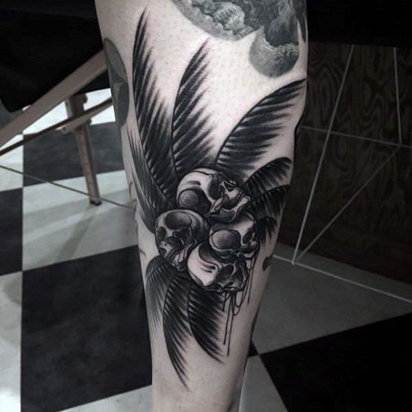 Original black ink palm tree with skull shaped coconuts tattoo on leg