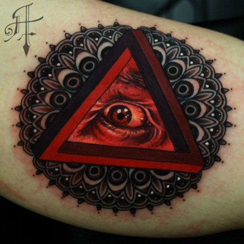 Original combined and colored arm tattoo of triangle with human eye and ornamental flower