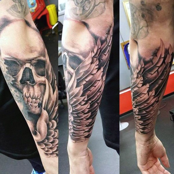 Original combined black and white skull with wings tattoo on sleeve
