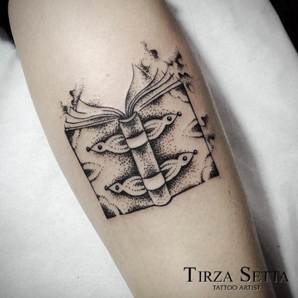 Original design black and white open book tattoo by Tirza Setta