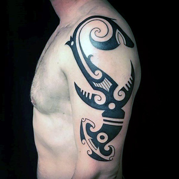 Original design dark black ink big size hammerhead shark tattoo on upper arm in tribal style