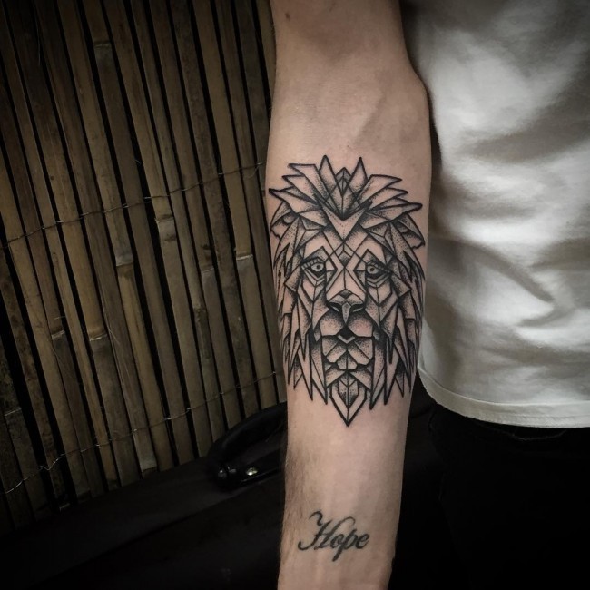 Original design lion's head forearm black and white tattoo in geometrical style