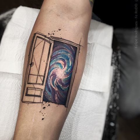 Original designed and colored forearm tattoo of big door with space galaxy