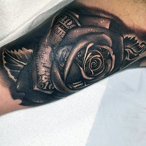 Original designed black and white rose flower tattoo on arm with dollar bill