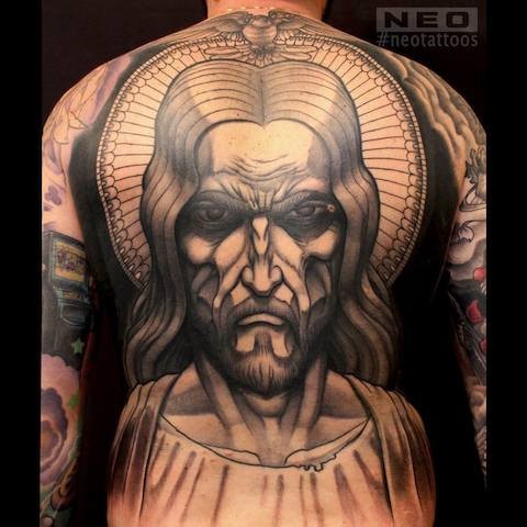 Original designed colored angry Jesus portrait tattoo on whole back area