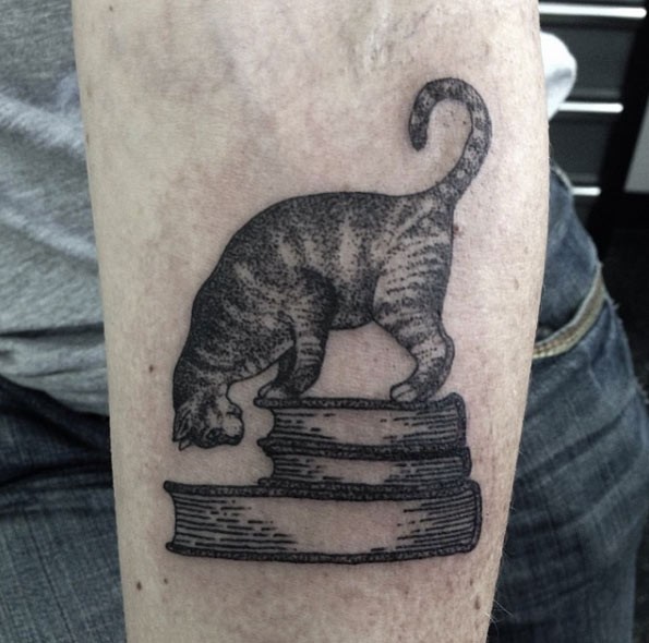 Original designed dot style forearm tattoo of cat with books