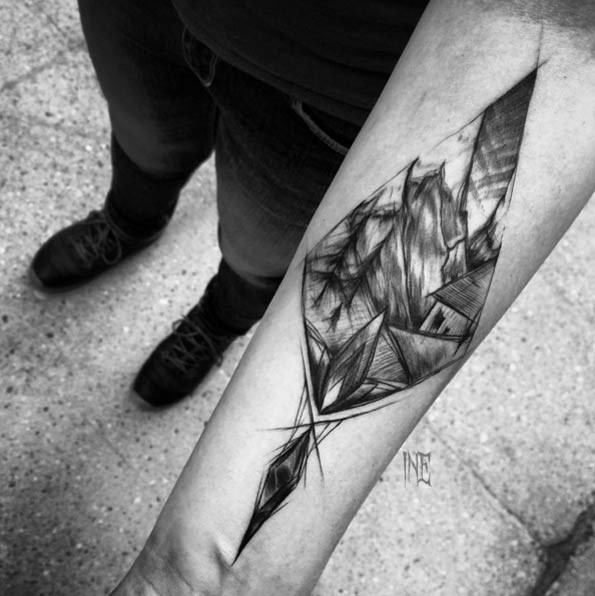 Original geometrical shaped forearm tattoo stylized with old tree house