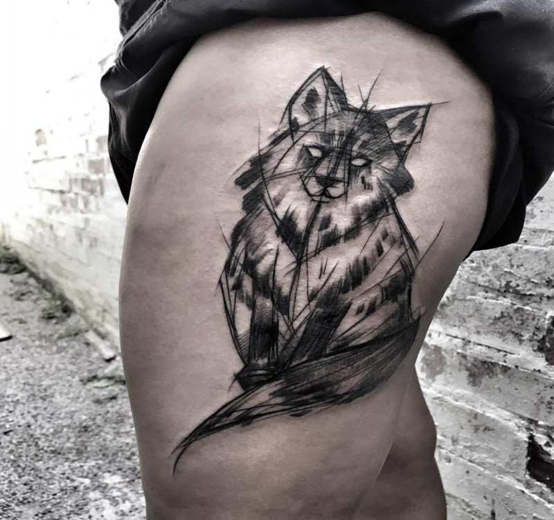 Original looking black ink painted by Inez Janiak thigh tattoo of big cat