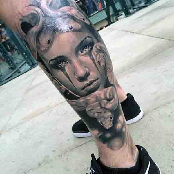 Original looking designed black ink crying Medusa portrait tattoo on arm