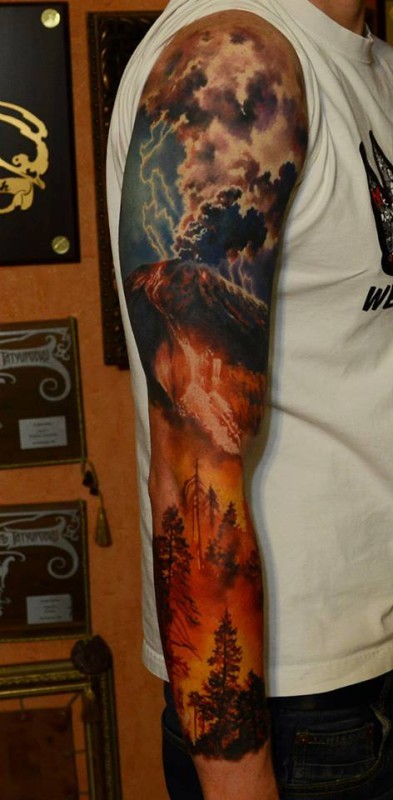 Original painted big burning volcano with doomed forest tattoo on sleeve