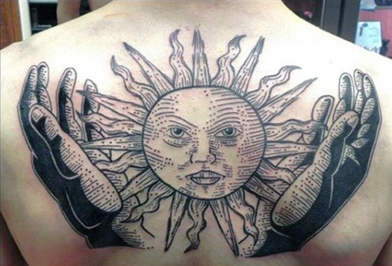 Original painted big hands with sun tattoo on upper back