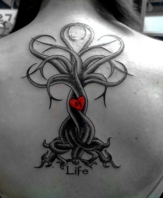 Original painted black lonely tree with red heart and lettering tattoo on upper back