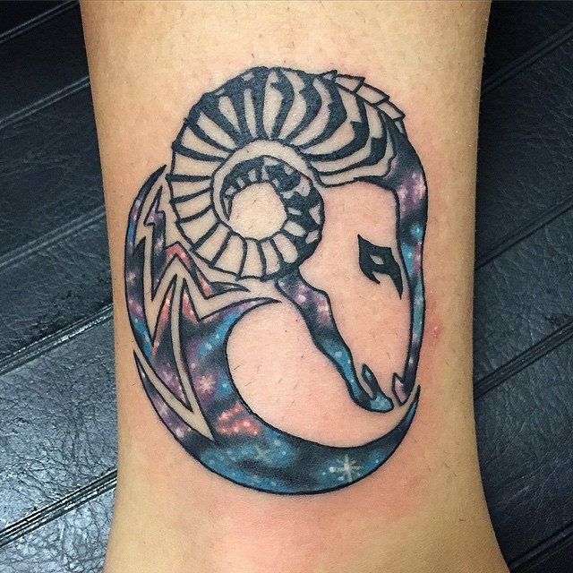 Original tribal style painted goat tattoo on leg stylized with space