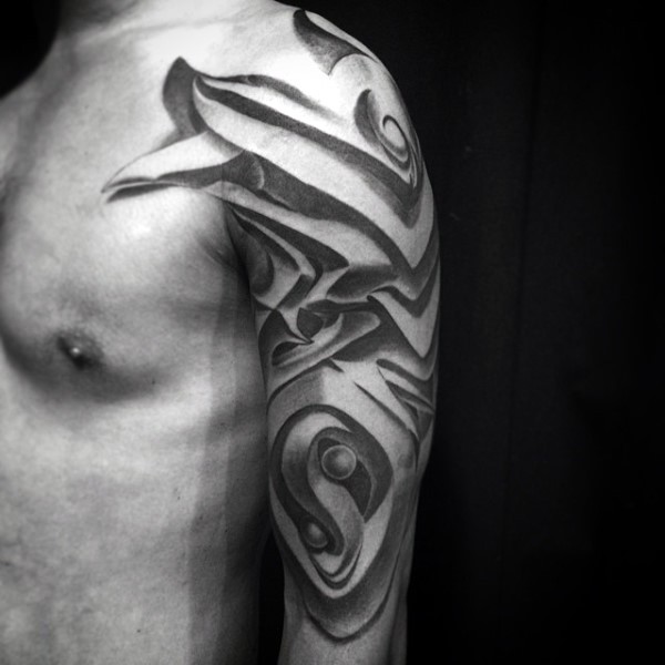 Ornamental style black ink shoulder tattoo of fantasy armor