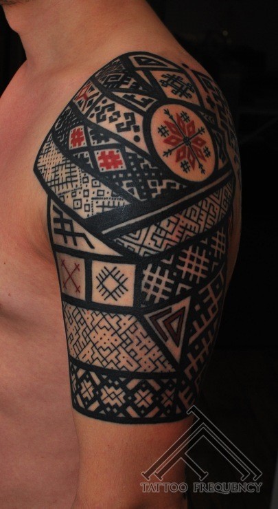 Ornamental style colored shoulder tattoo if Asian armor with ornaments