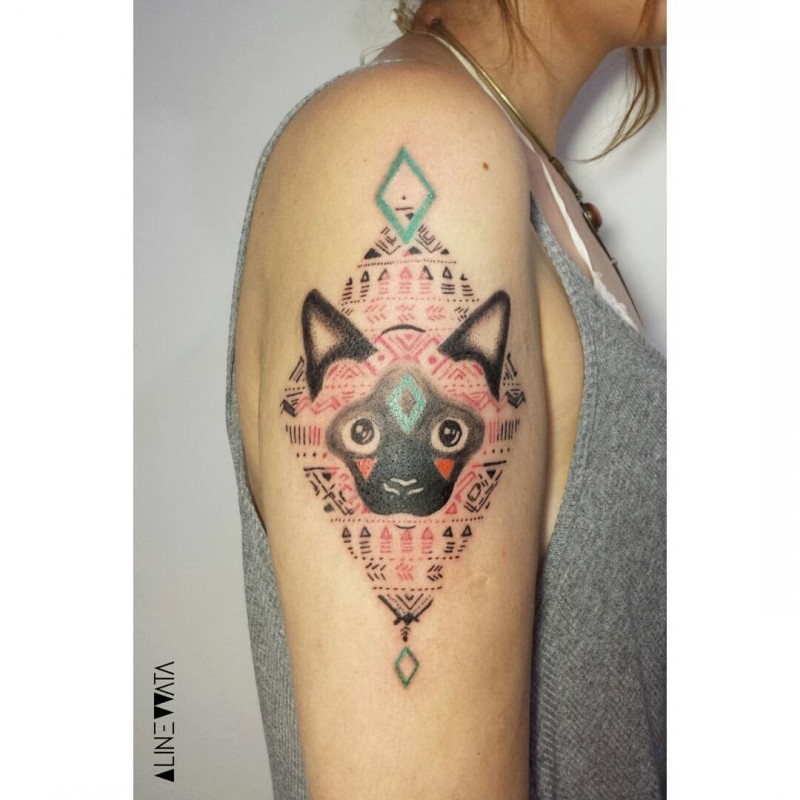 Ornamental style colored shoulder tattoo of cat with various ornaments