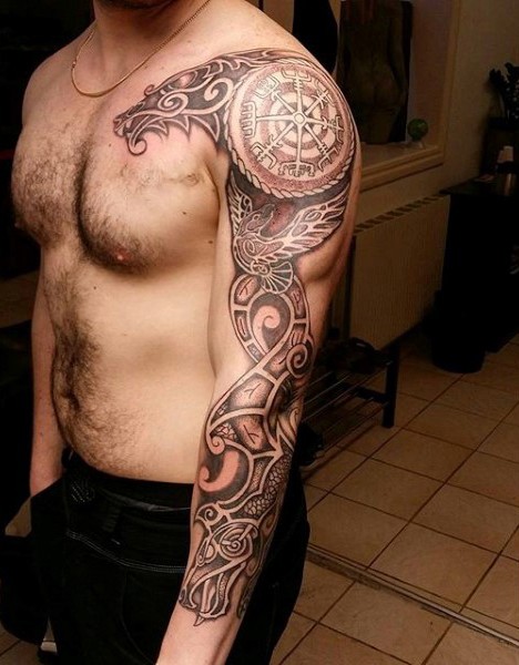 Ornamental style colored sleeve tattoo of ancient ornament