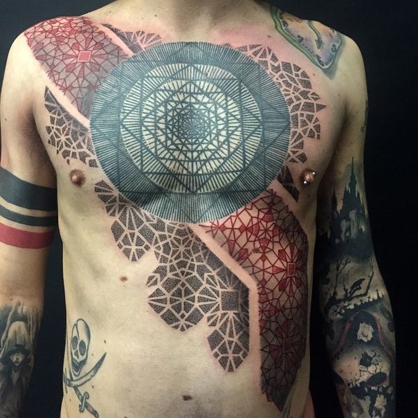 Ornamental style large chest and belly tattoo of various ornaments
