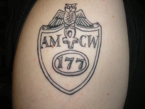 Owl with ankh on shield symbol tattoo